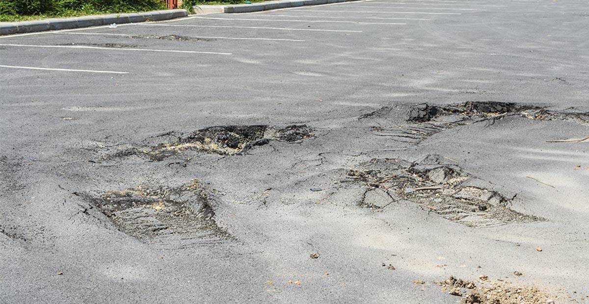 How A Damaged Asphalt Parking Lot Can Hurt Your Business